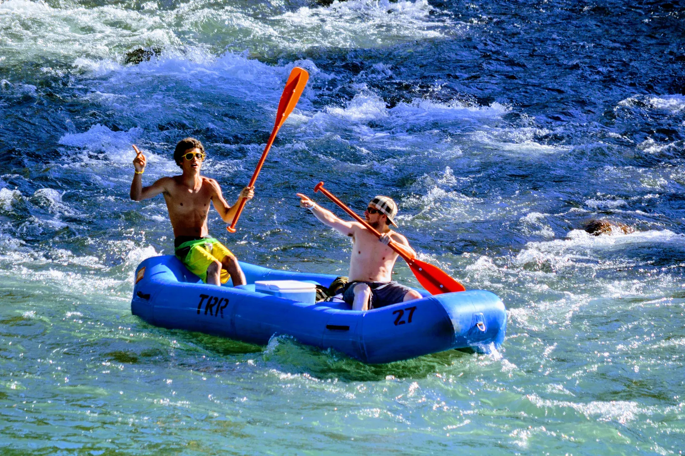 Two rafters paddling through a lively section of the Truckee River