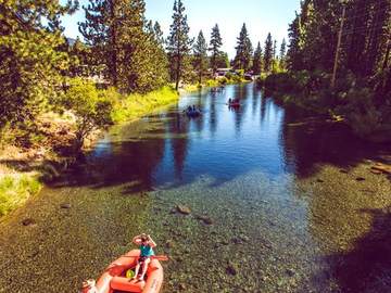 A family rafting the Truckee River near Tahoe City