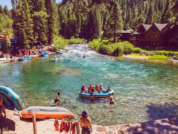 Rafts pulled up on the bank along the Truckee River